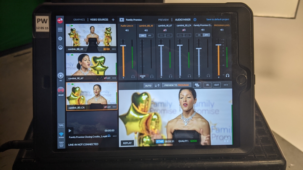 Multi-camera live production setup displaying a corporate gala awards event on preview screens